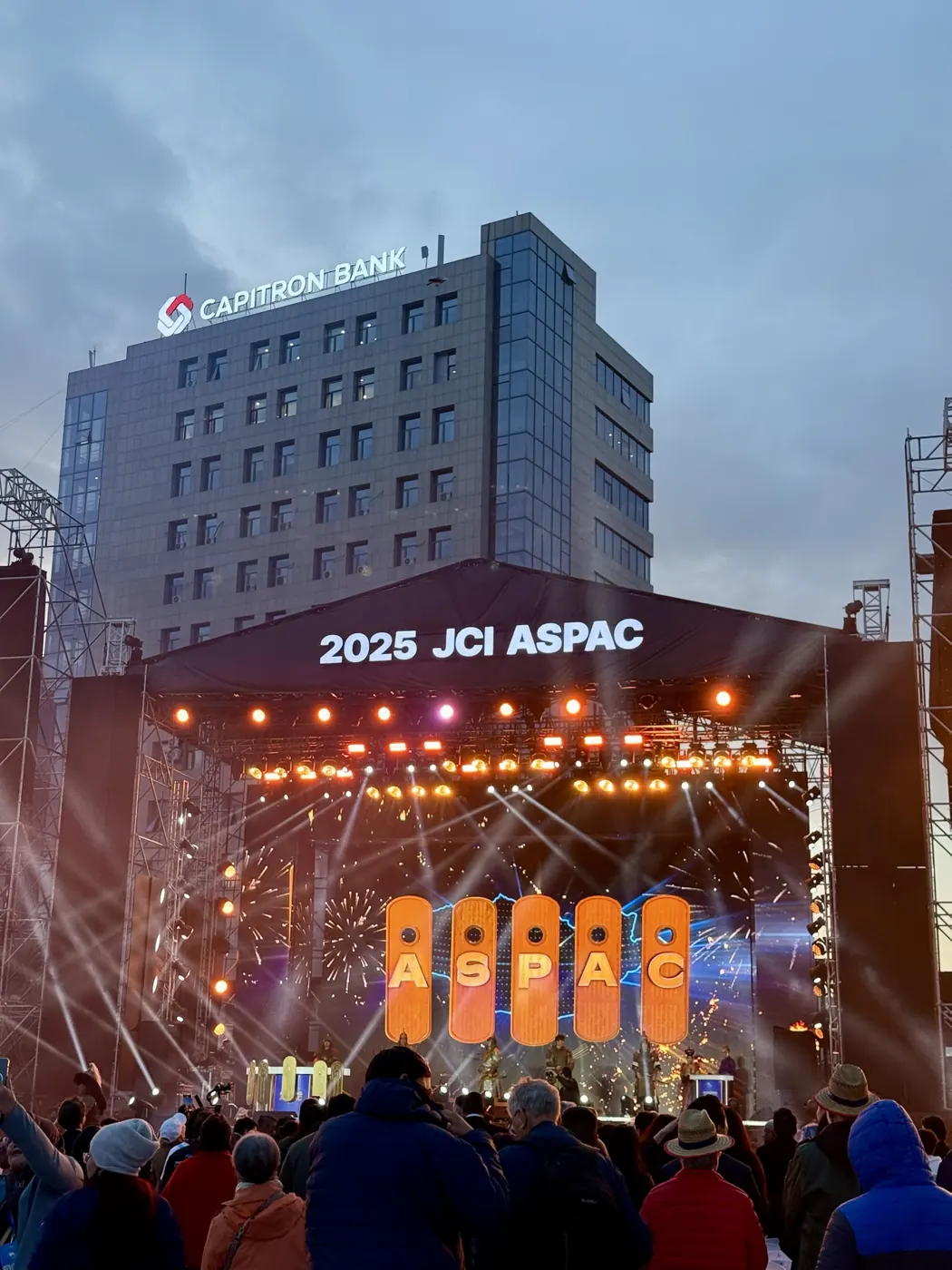 The JCI ASPAC 2025 stage lit up at dusk in Ulaanbaatar