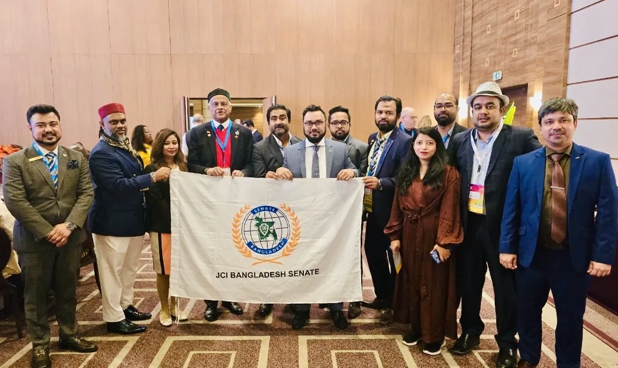 Afshana with members of JCI Bangladesh Senate holding their flag