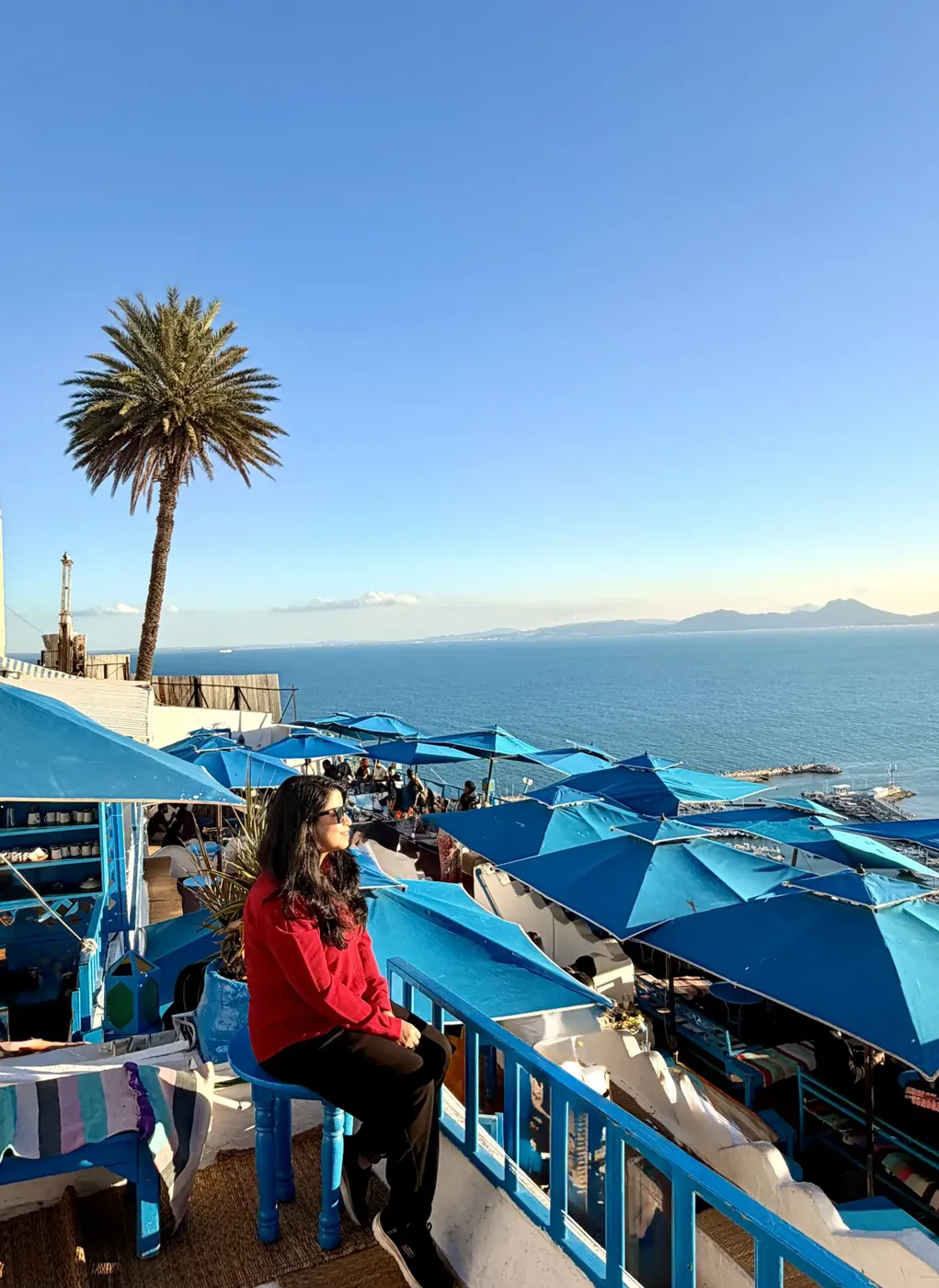Afshana on a terrace in Sidi Bou Said above the Gulf of Tunis