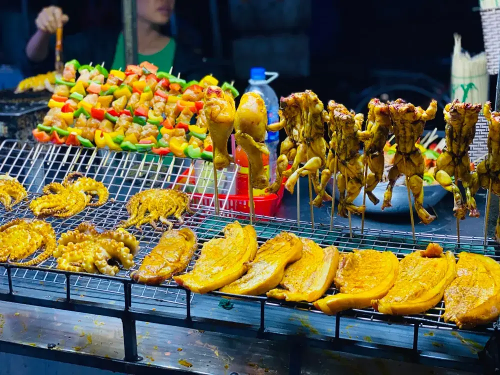 Skewers and grilled food at a night market stall