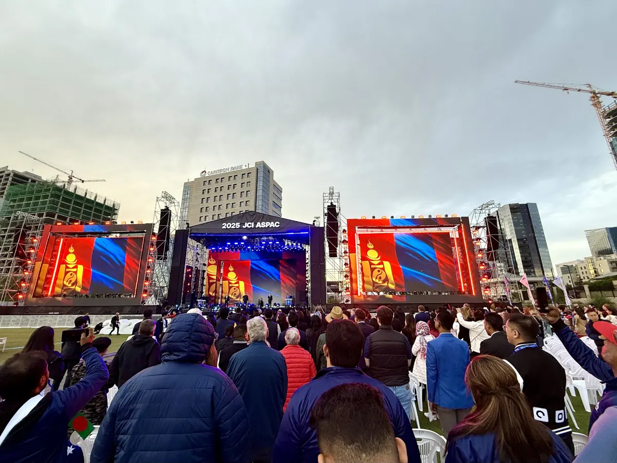 The JCI ASPAC 2025 opening ceremony in Ulaanbaatar with the Mongolian flag on giant screens